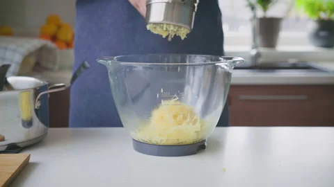 A man at home makes mashed potatoes Stock Footage 221469768