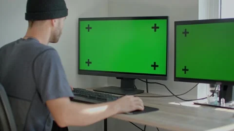Man at home office on computer, green screen mockup 库存影片 218466869