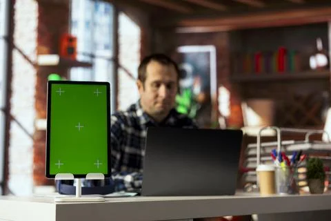 Man in home office using isolated screen tablet, preparing presentation slides Stock Photos