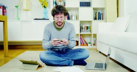 Man at home texting message with cell phone Stock Footage 70863583
