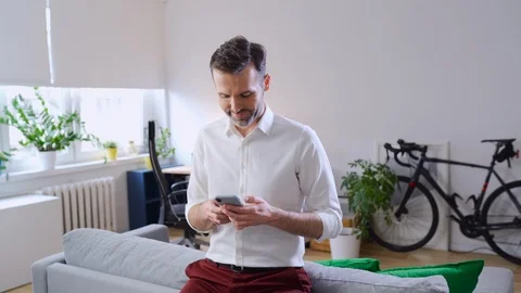 Man at home using smartphone Video stock 126823022