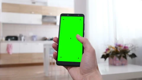 Man at Home Using Smartphone with Green Screen. Point of View Camera Shot. Stock Footage 150216562