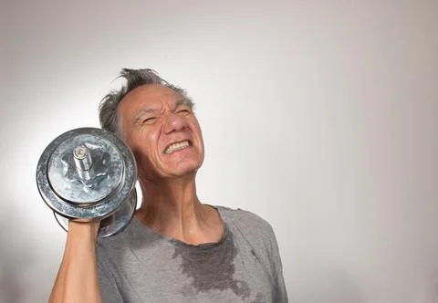 Man at Home working out with Weights Stock Photos