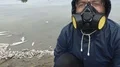Man with a hood and dead fish  4k or 4k+ Resolution