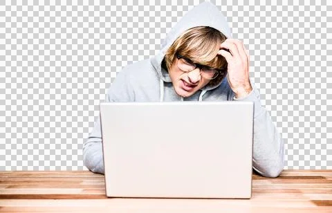 Man in hood jacket hacking a laptop Stock Photos