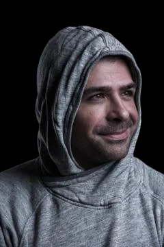 Man in hood looking sideways Stock Photos