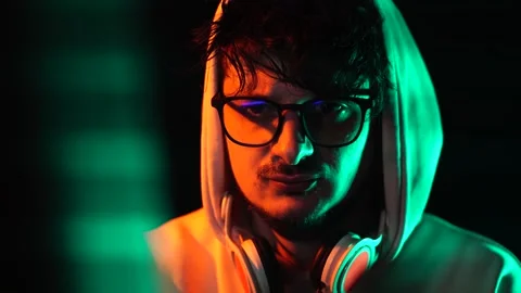 Man in Hoodie WIth Glasses Working on Computer From 1990's, Portrait Close Up Stock Footage 302173350