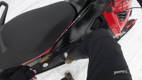 Man hopping on a snowmobile in winter, getting ready to drive a snowmobile. 스톡 동영상 149397284