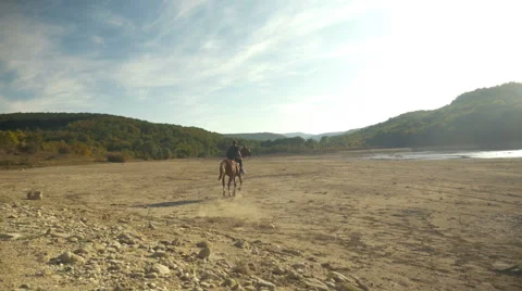 A man on a horse galloping Stock Footage 63042023