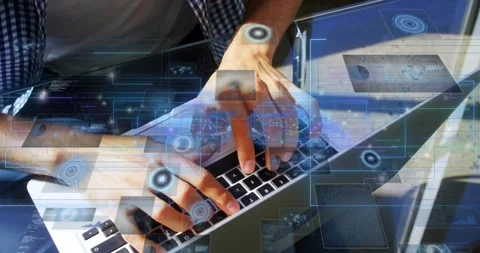 Man hovering then typing on laptop at glass table, HUD reacting to keys, Stock Footage 333965083