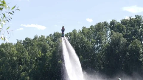 Man hovers high above using water under pressure Video stock 81884481