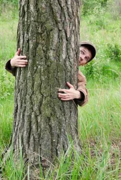 Man hugging tree Stock Photos