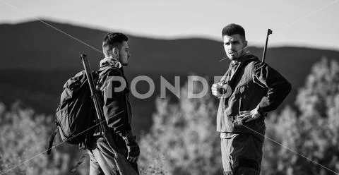 Man hunters with rifle gun. Boot camp. Friendship of men hunters. Army forces Stock Photos