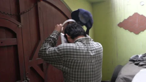 A man in a hurry putting on a protective face mask Stock Footage 140295255