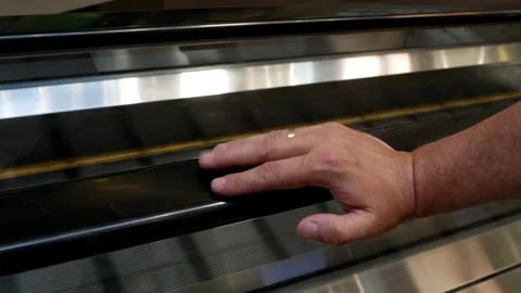 A man hurrying a meeting or work. Close-up of a human's hand going up an escalat Stock Footage 278090459