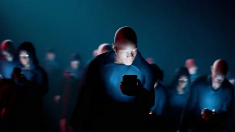 Man hypnotized by his mobile walks in the dark crowd. Zombie walk.  Mind control Stock Footage 158242578