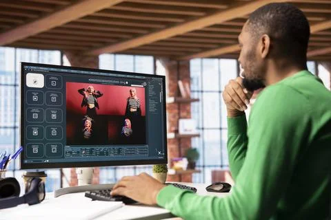 Man i using AI software on computer turning text prompt into photos Stock Photos