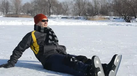 Man on the ice in a city park Stock Footage 10770706