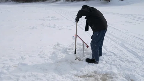 Man ice fishing Stock Footage 109182653