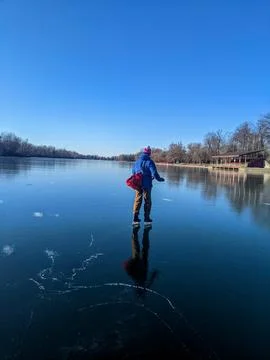 Man Ice Skating on Smooth Clear Black Ice at Toronto Island 스톡 사진