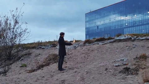 Man Igniting and Throwing Molotov Cocktail Stock Footage 69155055