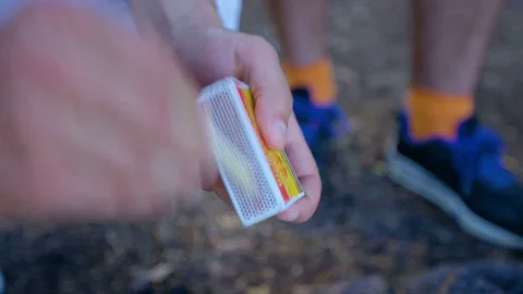 Man igniting a match Stock Footage 75445028