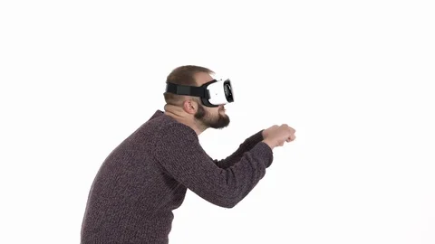 Man imitates driving car in virtual reality glasses. Cool high tech devices Stock Footage 121196033