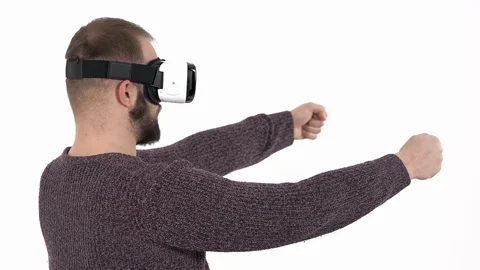 Man imitates driving car in virtual reality glasses. 3d cyberspace simulation Stock Footage 121196212