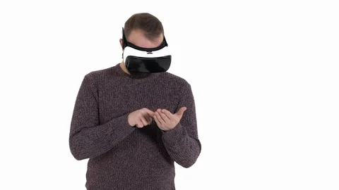 Man imitates smartphone using while wearing VR glasses. Digital age and new Stock Footage 121195235
