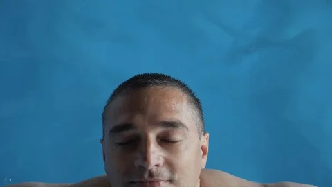 Man immersed in clean water in the pool. Stock Footage 107855364