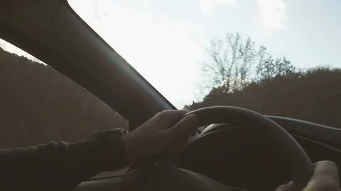 The man indicates the direction of the road in the car Stock Footage 82933094