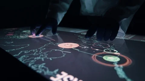 Man indicators on sensor touch screen sensory interactive table in the dark. Stock Footage 106339454