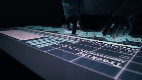 Man indicators on sensor touch screen sensory interactive table in the dark. Stock Footage 106339625