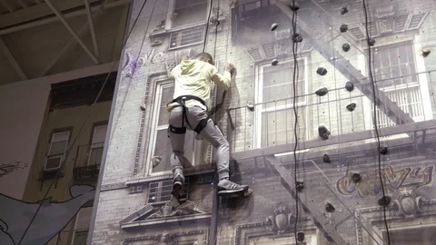 Man On An Indoor Climbing Wall Stock Footage 71228919