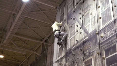 Man On An Indoor Climbing Wall Stock Footage 71229412