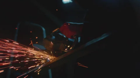 Man industrial worker or construction worker cuts metal with a angle grinder Stock Footage 328092228