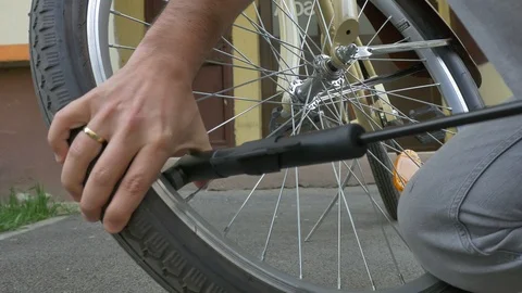 Man Inflates Bicycle Tyre Stock-Footage 88633698