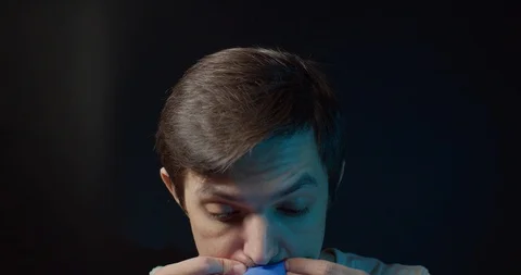Man inflates a rubber glove Stock Footage 127633901