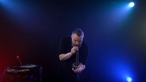 Man inflates a soap bubble and sets it on fire in the air Stock Footage 125691277