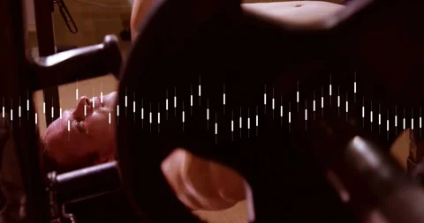 Man inhaling for chest workout lifting barbell off press rack in gym, with Stock Footage 317841371