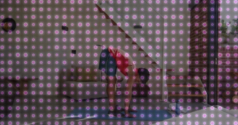 Man initiating hamstring stretch by lowering arms and hinging forward on blue Stock Footage 316338490