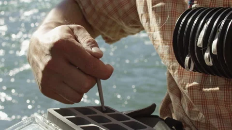 Man injecting in tackle box Stock Footage 59899412