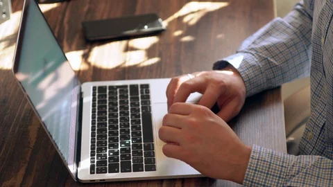 Man inputting data on a laptop computer Stock Footage 125897079
