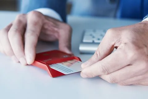Man insearting an electronic identification in a reader Foto stock