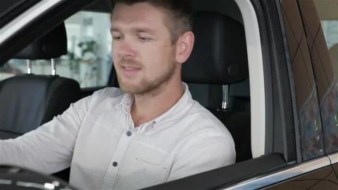 Man insert the key into the ignition lock of the car Stock Footage 248914848