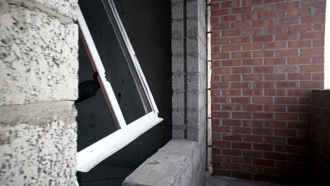 Man insert a plastic window in the opening Stock Footage 82310454