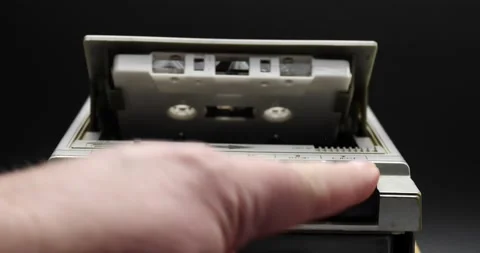 Man inserting a casette tape into a recorder Video stock 169683503