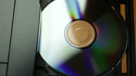 Man inserting disc into computer Stock Footage 22027625