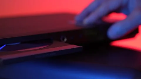 Man inserting disk into DVD player Stock Footage 315019652