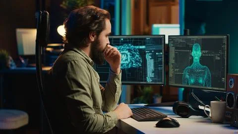 Man inserting disk into PC containing software turning AI into sentient being Stock Photos